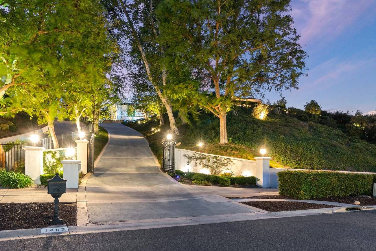 1403 Kingsboro Court — lit private drive at night