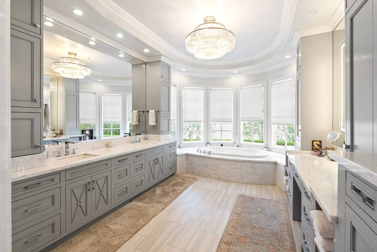 1403 Kingsboro Court — primary bath with soaking tub and chandelier