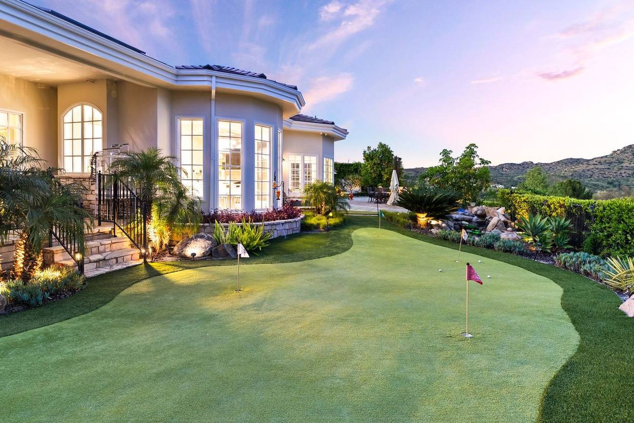 1403 Kingsboro Court — private putting green at twilight